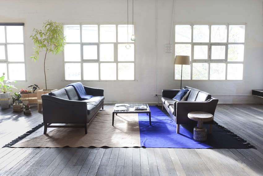 Even in a huge space like this hotel loft by Lost & Found, you can create an intimate grouping by positioning seating and side tables close together.