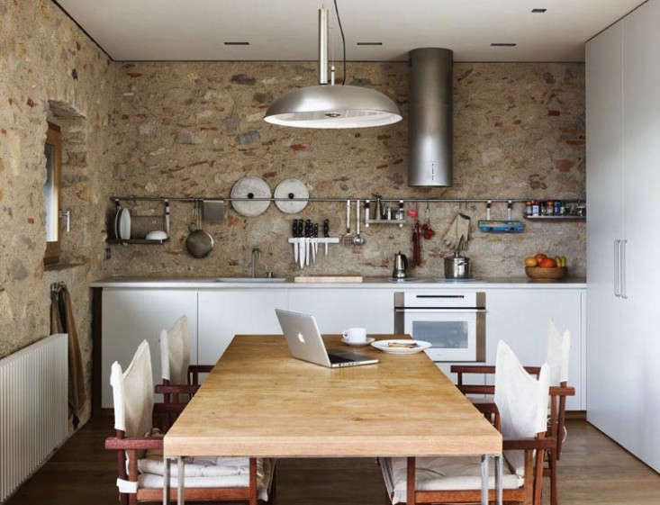 A long Grundtal rail and hanging Grundtal Shelf in a Barcelona kitchen by Anna Noguera from Medieval Meets Modern in Catalonia.