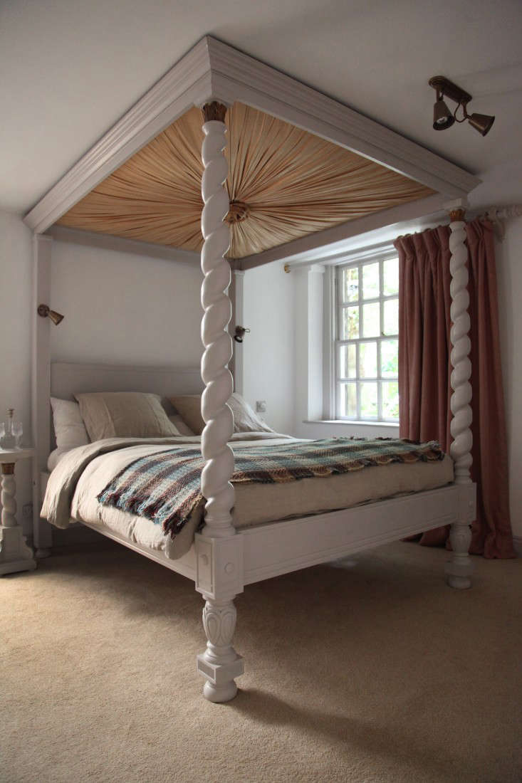 A fringed wool blanket on a canopy bed; see more in Berdoulat & Breakfast: A B&B in Bath.