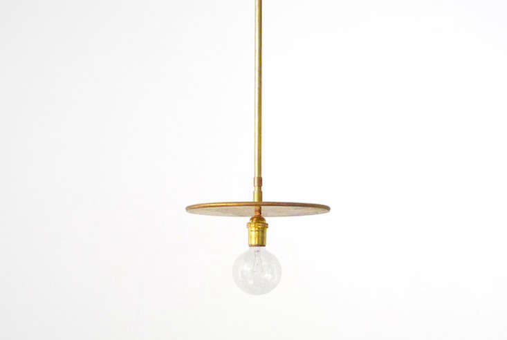 7 Favorites Minimalist Brass Pendants Remodelista Above The Brass Pendant By Workstead Features A 10 Inch Disk Long Rod And Socket Joint Allows For 90 Degrees Of Rotation