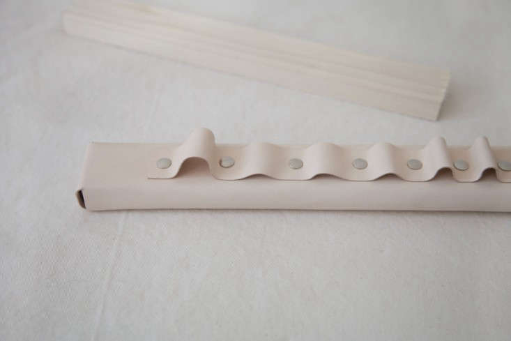 Step 6: To mount the finished rack on the wall, there are a variety of options: You can hang it like a picture frame using a length of wire and pushpins on the back, you can nail the entire piece to the wall, or you can nail two sawtooth hangers on the back and hook them onto the wall (the approach I took).