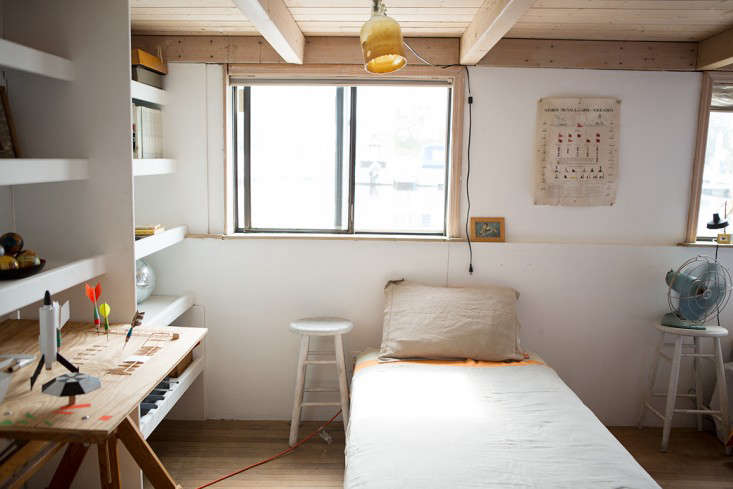 The additional three bunks are below deck. This one has a ceiling light made from a beeswax-dipped glass jug with the bottom cut off.