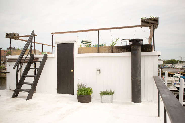 Stairs beyond the kitchen lead to the two-tiered roof where big parties take place (maximum capacity, they