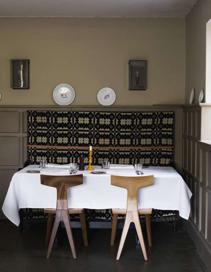 An all-time favorite: Melin Tregwynt blankets from Wales draped over banquettes in the Ilse Crawford-designed Olde Bell Inn, an Elizabethan-era inn with a modern twist in Berkshire in the UK. See more in Steal This Look: The Olde Bell Inn Dining Room.