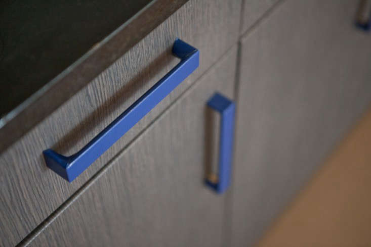 Or, wrap cabinet pulls in tape (these, in Rental Rehab: The DIY New York Apartment, are wrapped in textured blue duct tape cut with an X-Acto knife); rope or cloth could also work.