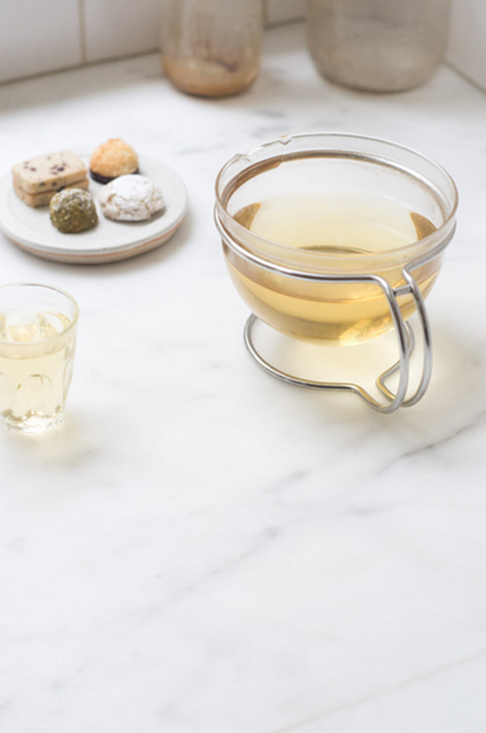 With the cold months ahead, Dalilah is warming up next to a German-made glass tea pot.