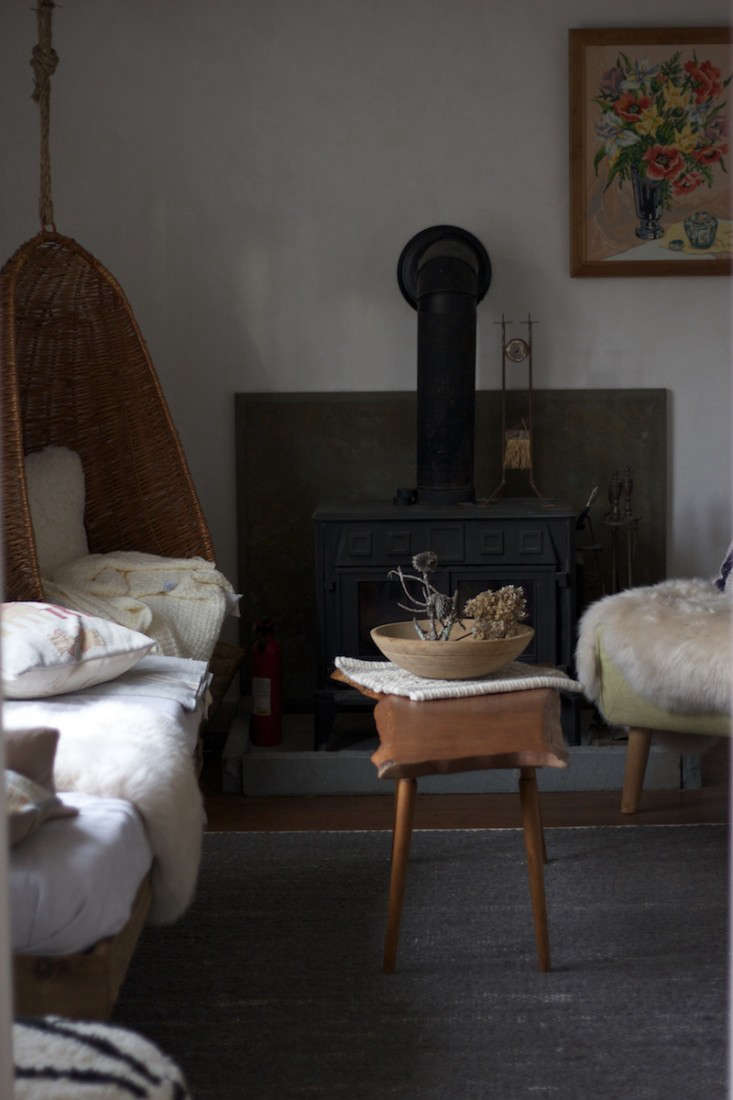 Polar vortex essentials: sheepskins and a wood stove. Photograph by Tara Mangini.from The One-Month Remodel: A Catskills Guesthouse by Jersey Ice Cream Co.