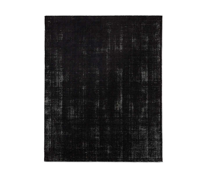 10 Easy Pieces Black Low Pile Area Rugs Remodelista Above The Distressed Wool Rug In Black Curly On For 1 035 Marked Down From 295 At Restoration Hardware