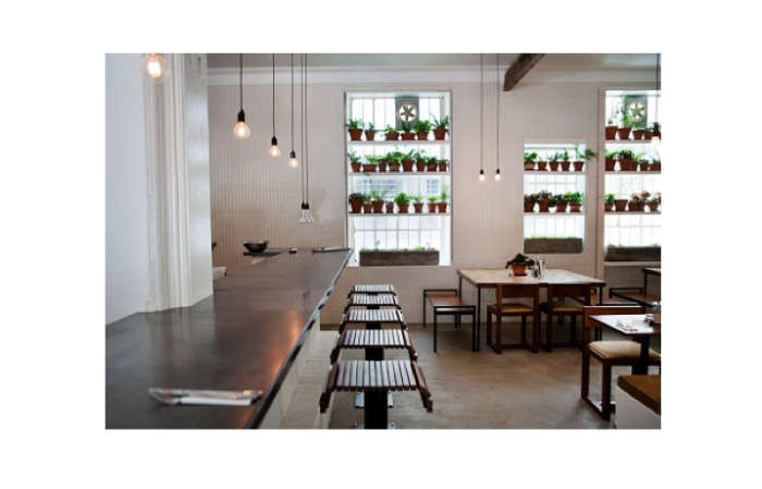 Stripped Down In Cape Town Clarke S Bar And Dining Room Remodelista Above A Row Of Black Pendant Cords Strung In Down The Main Bar