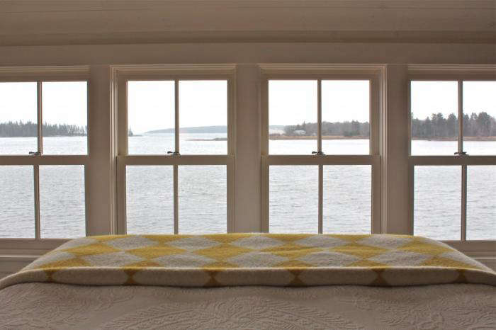 The summer bed, refreshed; see more in A Cottage Reborn in Coastal Maine.
