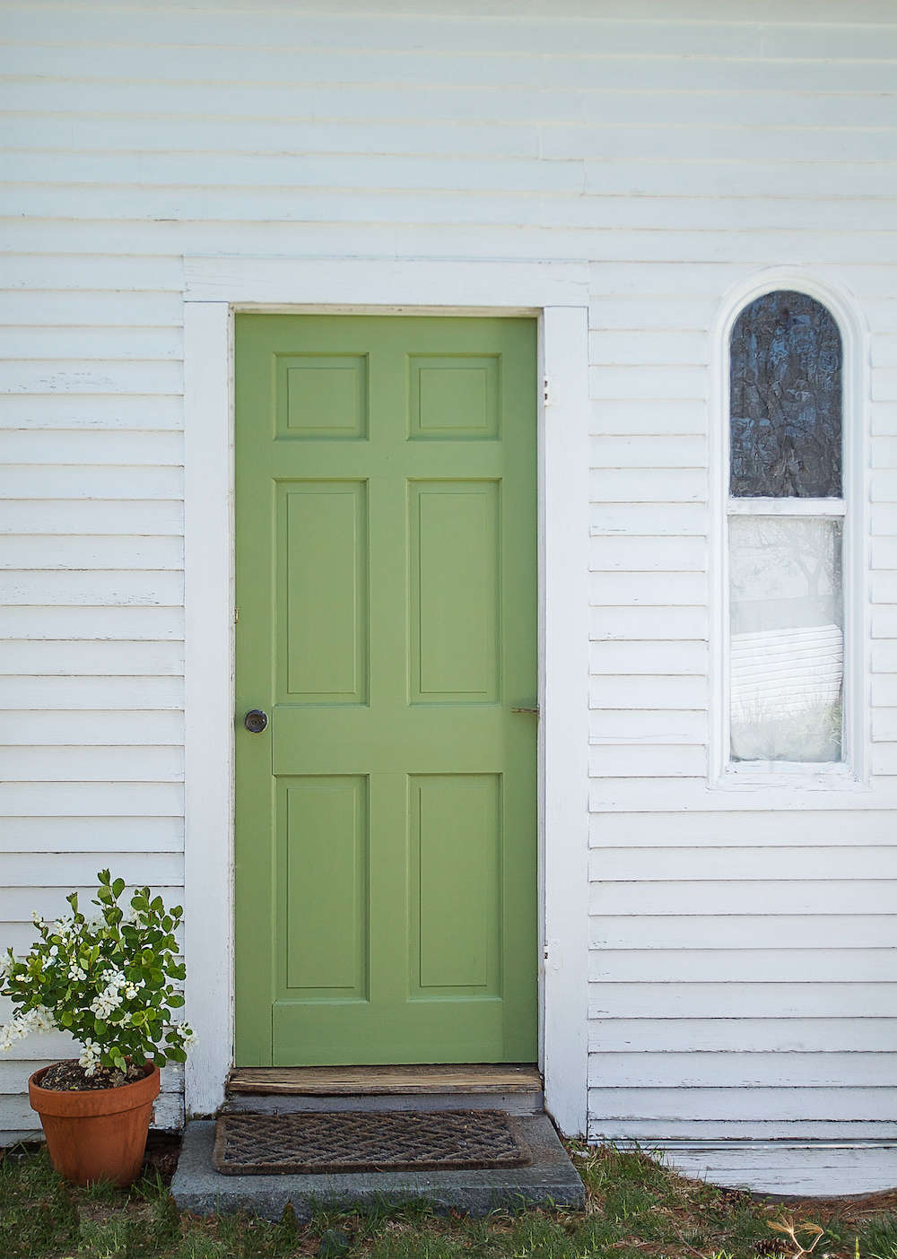 The front door of our guest cottage in Wellfleet; see A Spring Green Door with Farrow & Ball Paint.
