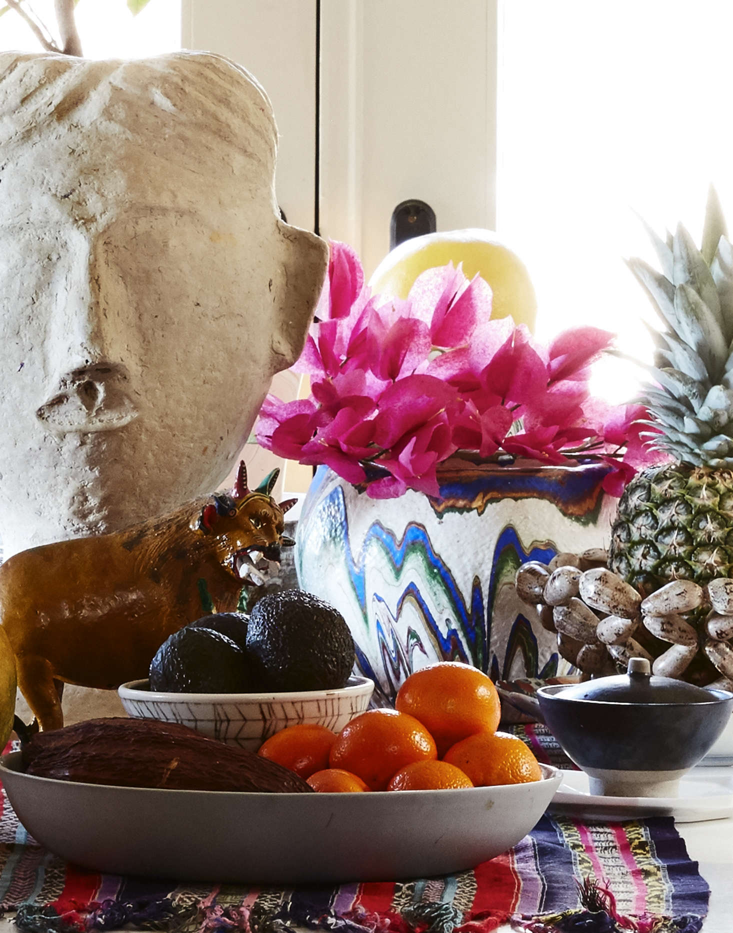 The table displays Livia’s rotating collection of pottery. The papier-mâché head was a surprise discovery of unknown origin from Home Goods.