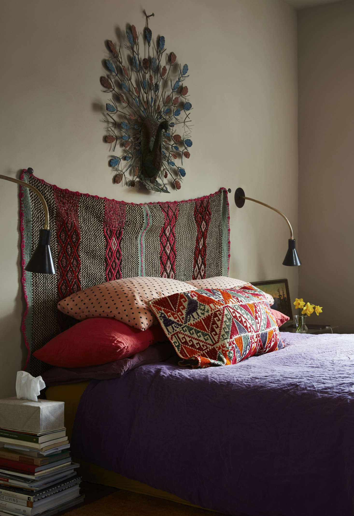 In the master bedroom, Livia hung an Andean frazada as the headboard. The blue metal ostrich over it is one of Livia’s mother’s finds. The linen sheets are by Italian line Society Limonta.