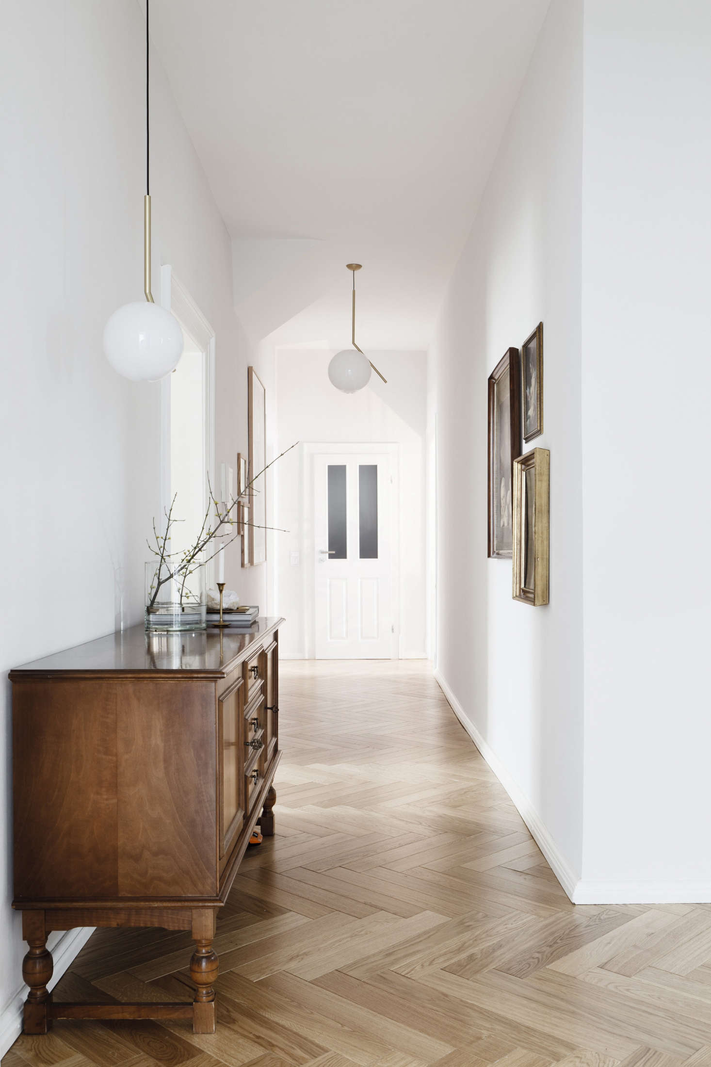 Herringbone floors in a German apartment by Leipzig-based Studio Oink, featured in Earthly and Ethereal: An Apartment Makeover by Studio Oink. Photograph by and courtesy of Studio Oink.