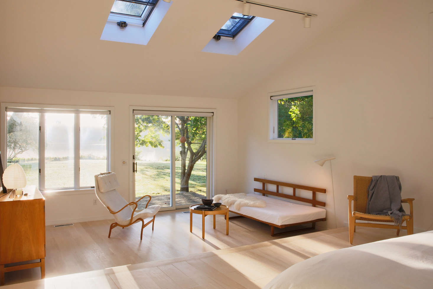 For the sunken lounge in the master bedroom, Jones sourced everything from Denmark auction houses, including a Børge Mogensen daybed and Bruno Mathsson armchair. The room gets prime afternoon light.