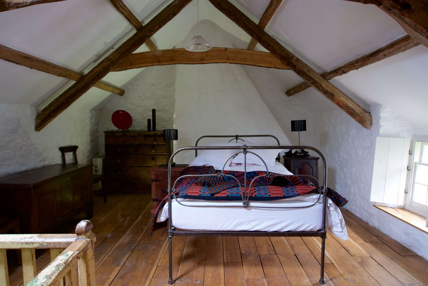 A woven blanket in more rustic environs; see The Welsh House: Slow Living in a Traditional Cottage, Available for Rent, in Wales for more.