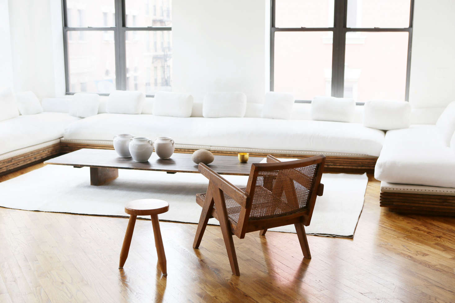 A Pierre Jeanneret teak and cane armchair from Cornelsen
