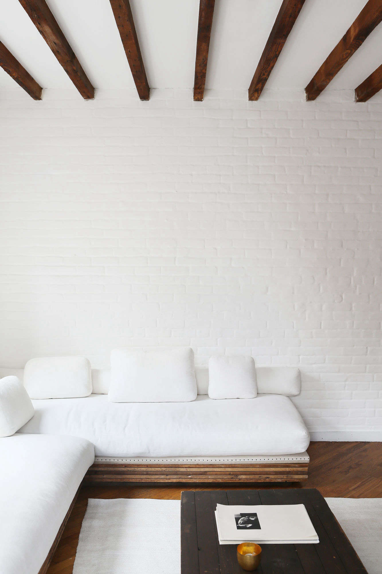 Javitch painted the brick walls with several coats of white paint 