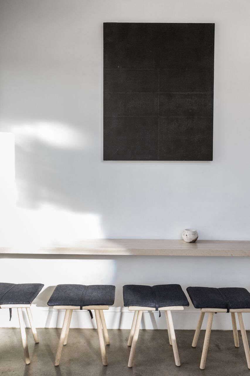 The pale oak furniture is by a friend of Kahn’s at the DMC Factory in LA.
