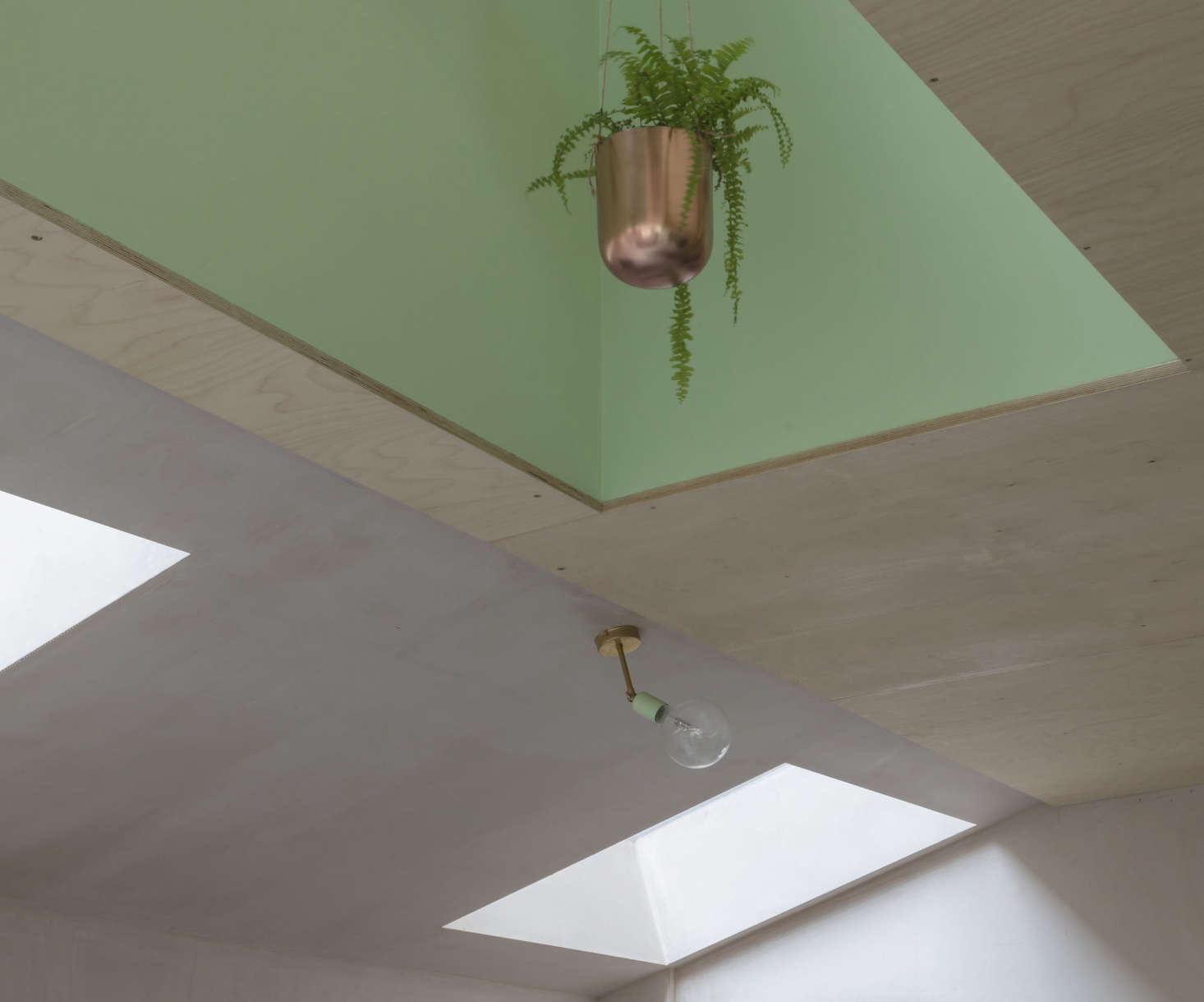 The family hung a series of copper planters in the recess over the island. For a similar design, consider Bloomingville’s Alisa Hanging Planter, $21.99 from Joss & Main. Go to Pots & Planters on Gardenista for more ideas.