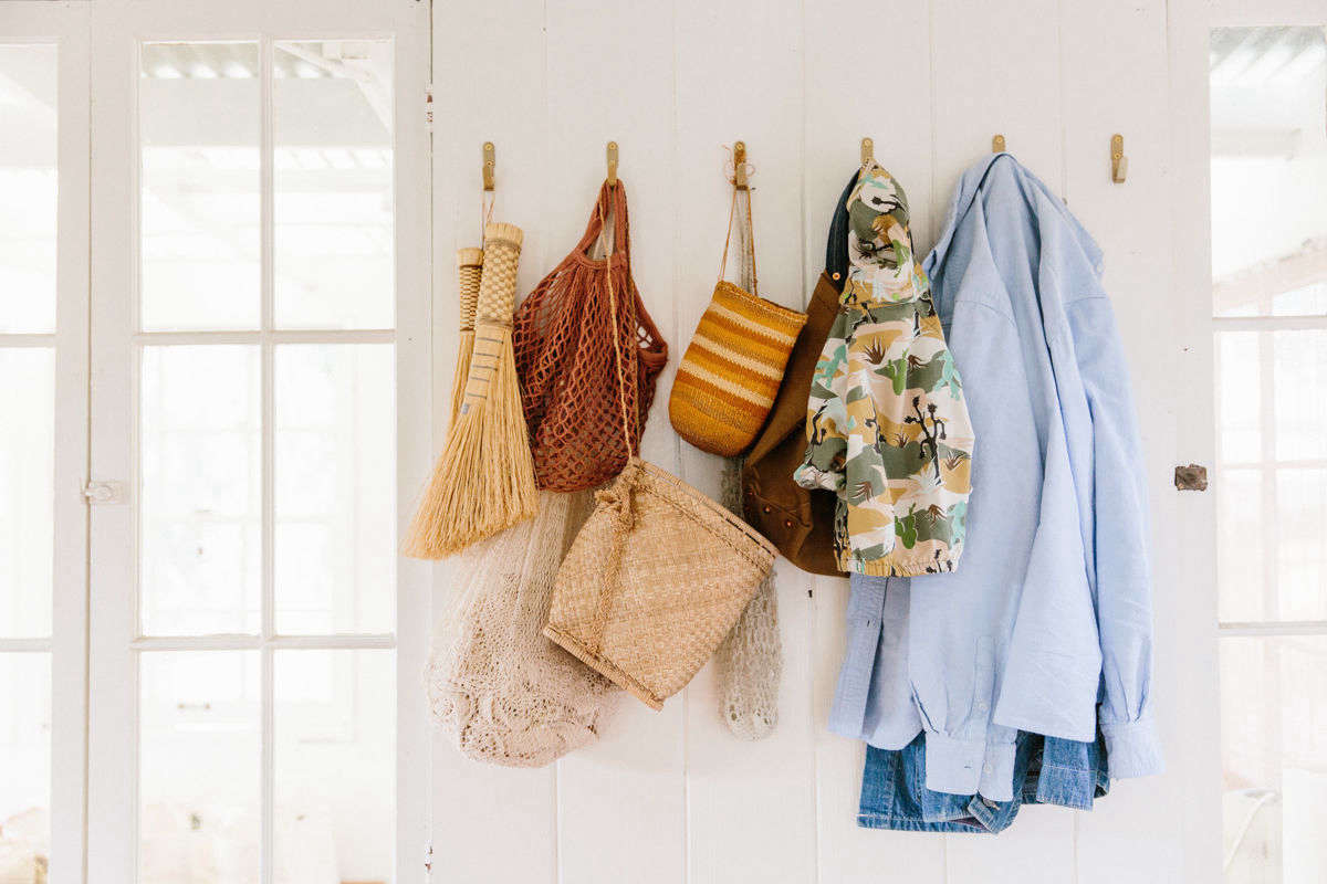 Near the kitchen, brass hooks by Counter-Space hold small brooms and market bags. For more of our favorite made-in-the-state hooks, see Made in California: 8 Design-Worthy Wall Hooks from the Golden State.