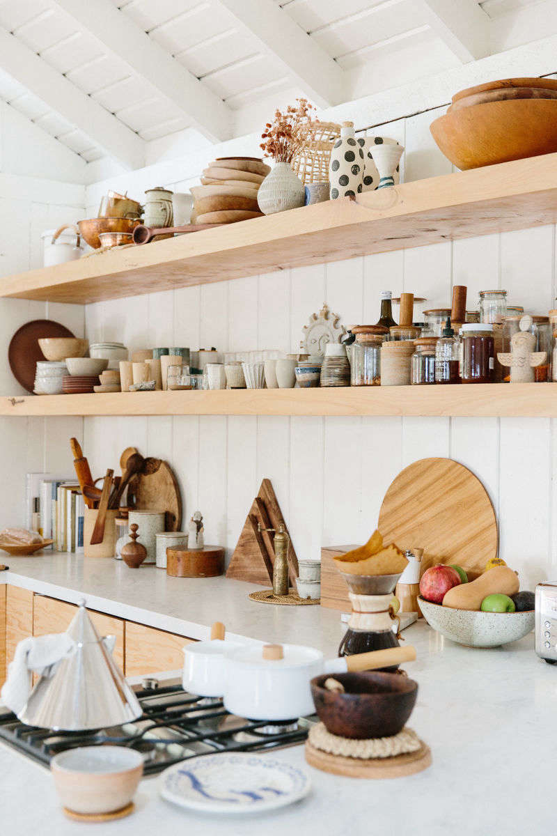The compact four-burner range conserves counter space. (For similar enamel pans, see 5 Favorites: Classic Enamel Milk Pans for Small Kitchen Tasks.)