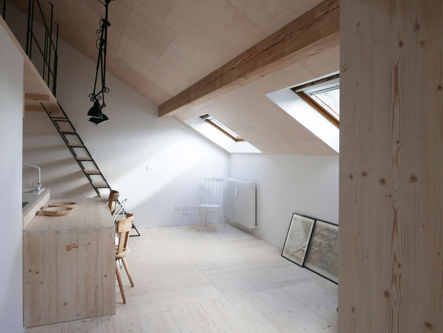 In A Light-Filled Chalet in the Italian Alps, Updated for a Young Skier, plywood adds detail to the steeply pitched ceiling.