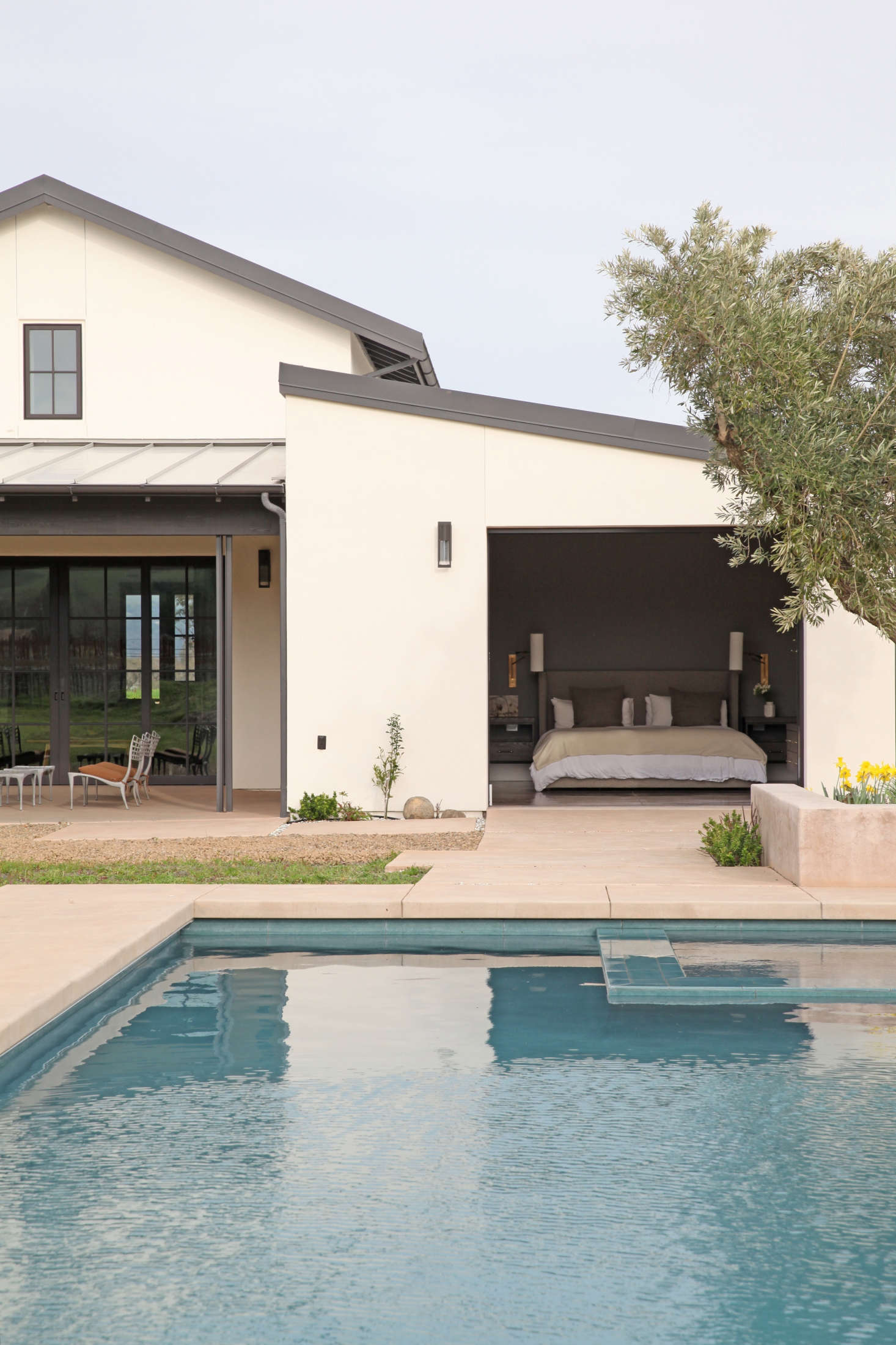 Though the landscape is still a work in progress, the pool and hot tub are ready for use. The couple