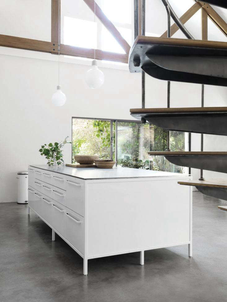 The Vipp island is 50 inches deep and ranges from 50 to 9 inches long, depending on the number of units used. A stovetop and sink can also be incorporated into the steel worktop. The small drawers are fitted with silicone cutlery inserts and larger drawers have protective silicone mats.