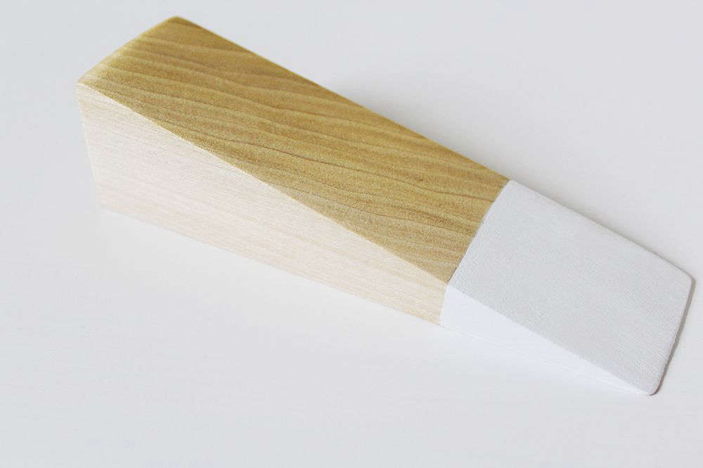 Step 2: Sand the wood, then mark (and tape off, if you like) the front section and paint white. Treat the rest of the wood with Polycrylic, but not the white tip (because the finish will yellow it).