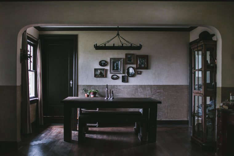 Flores’ dining room, with plaster inspired by a horror film and an ominous candelabra.