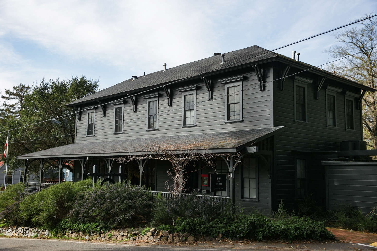 A Northern California Roadhouse Inn Red With Whimsy And The Building S Exterior Is Painted In Benjamin Moore Black Panther A Flat Finish With