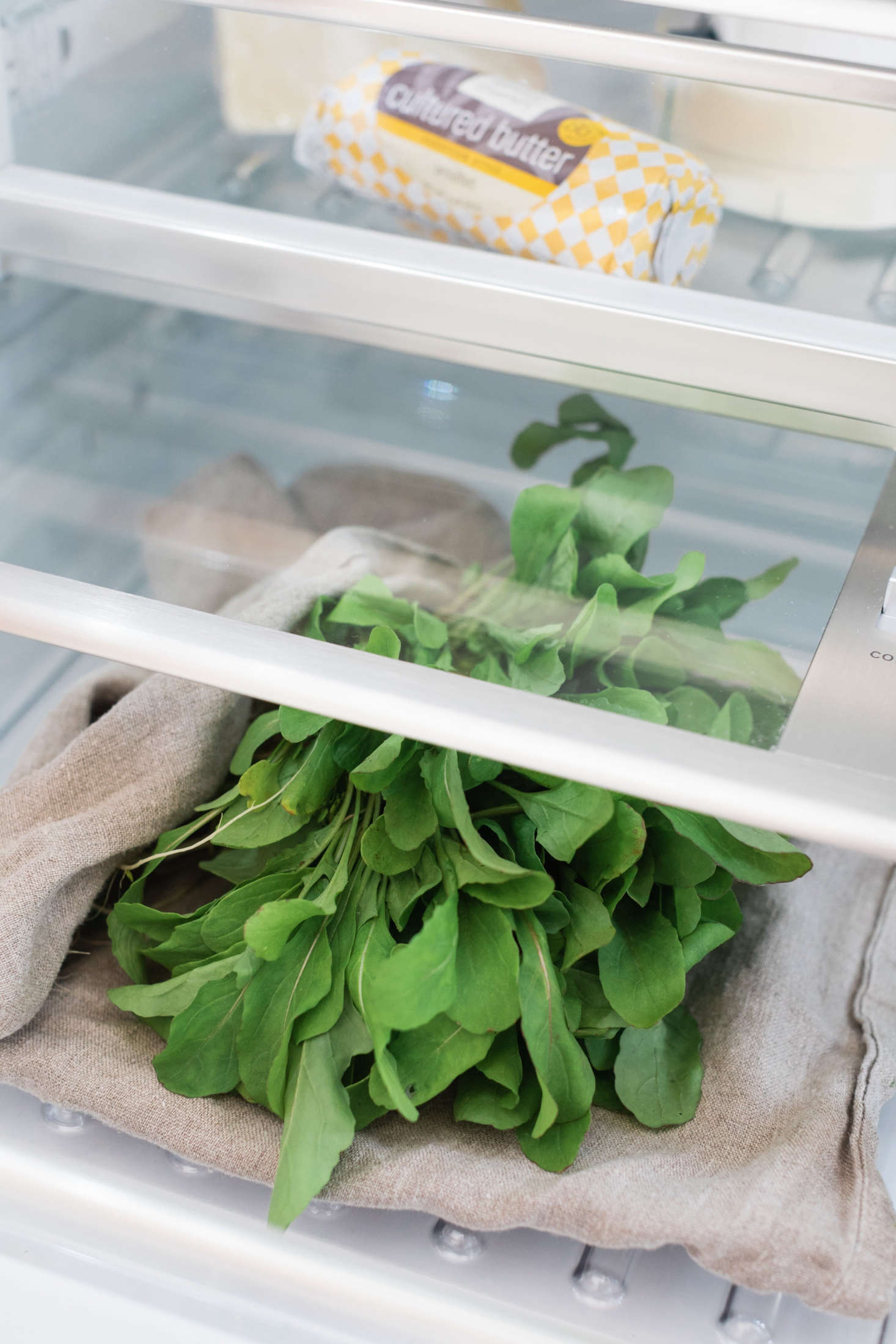 Lettuce is one of the more fragile foods in your fridge. Store lettuce in a loose, moistened towel in your crisper. (We used Ambitalia