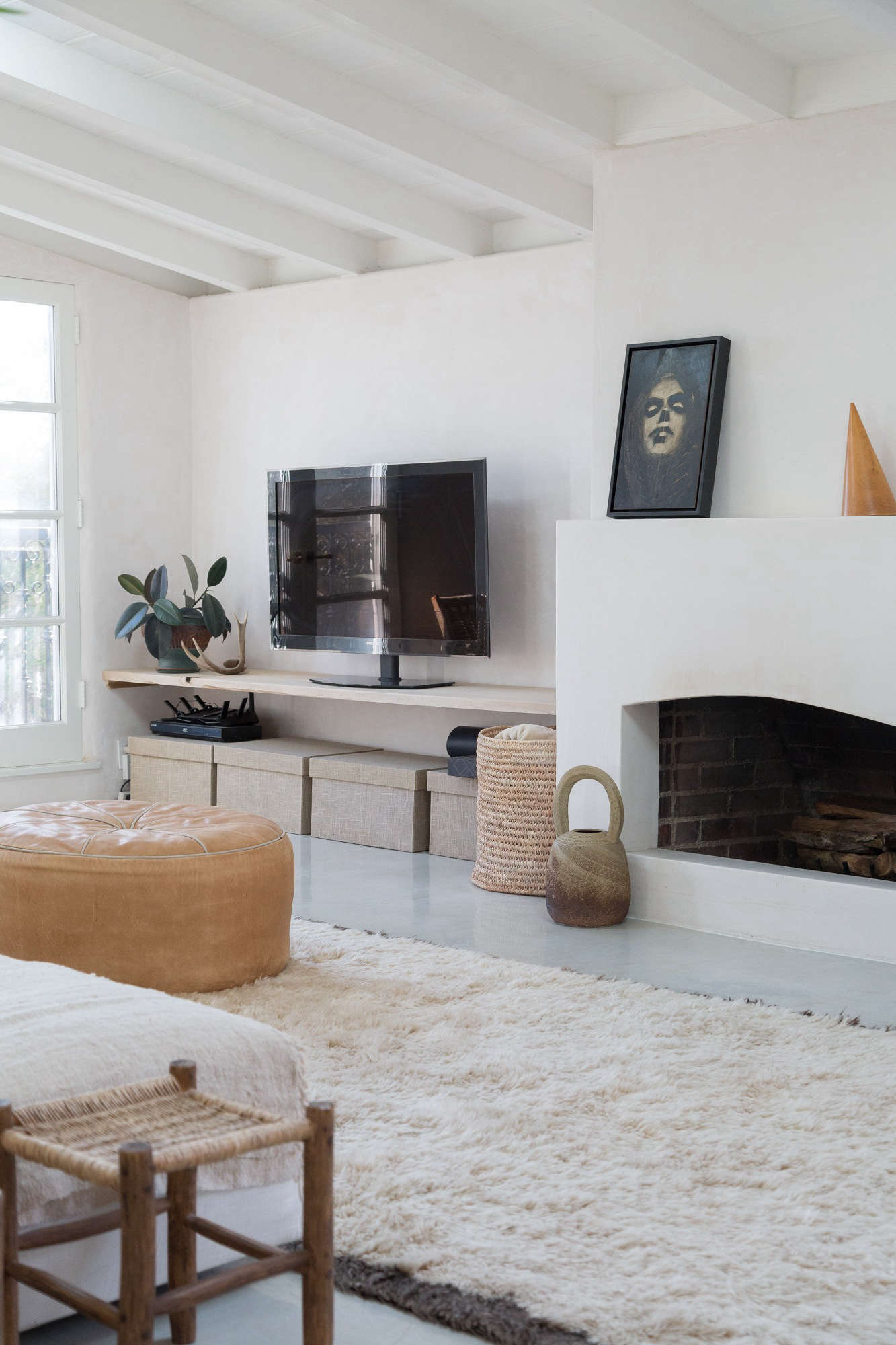 The poured-concrete floors are a new addition. Golubovic added a brown overtone to make it look aged and original to the house.