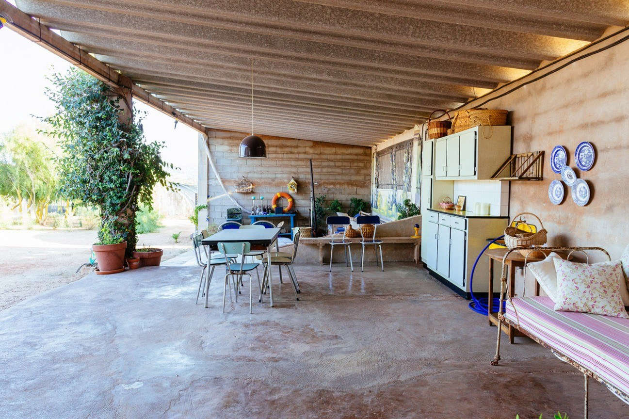 A covered patio serves as a gathering place for “eating, living, and chilling.”
