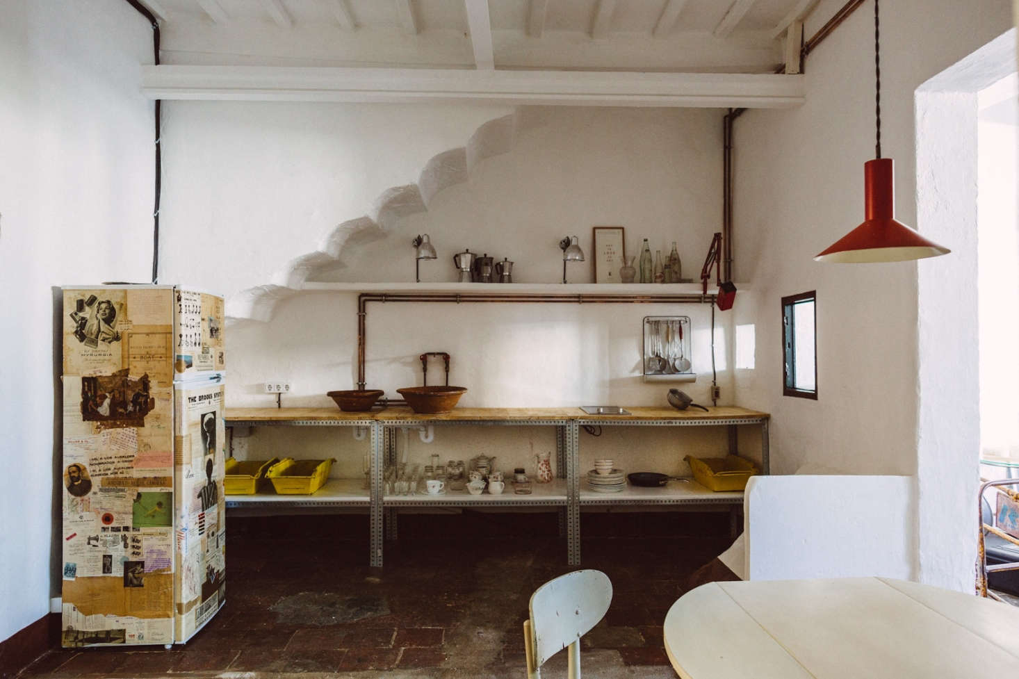 The designers outfitted a top-floor guest apartment in the house with an industrial kitchenette built using copper piping and modular steel shelving. “It’s not a place for a lot of cooking, just some tea and an omelette,” says Pols.