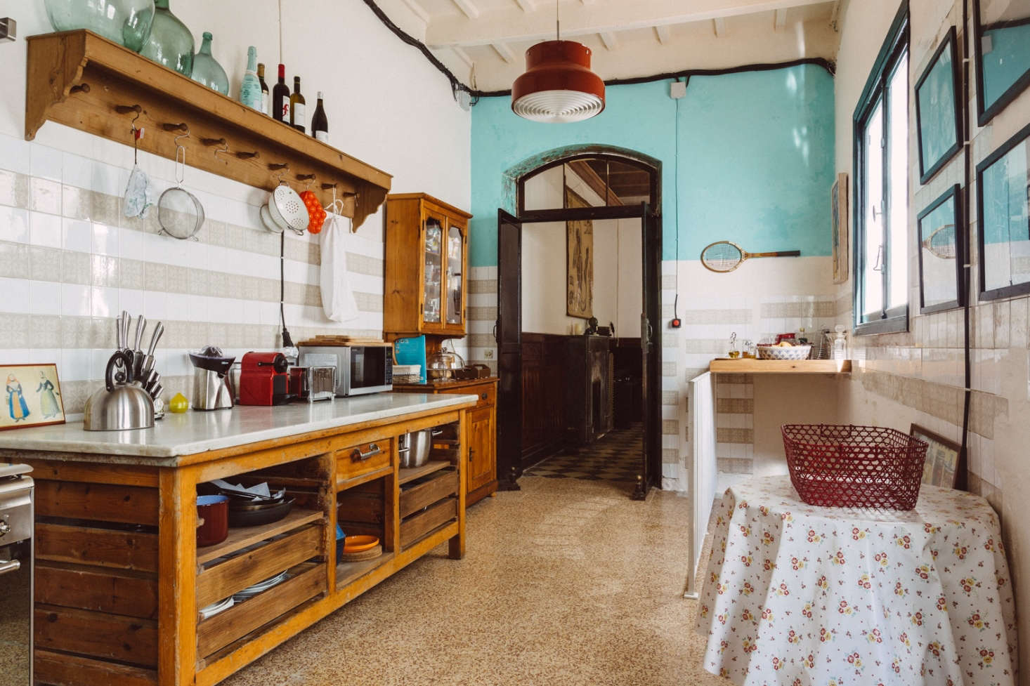 The marble-topped wooden counter and other furnishings are all vintage finds repurposed by the designers.