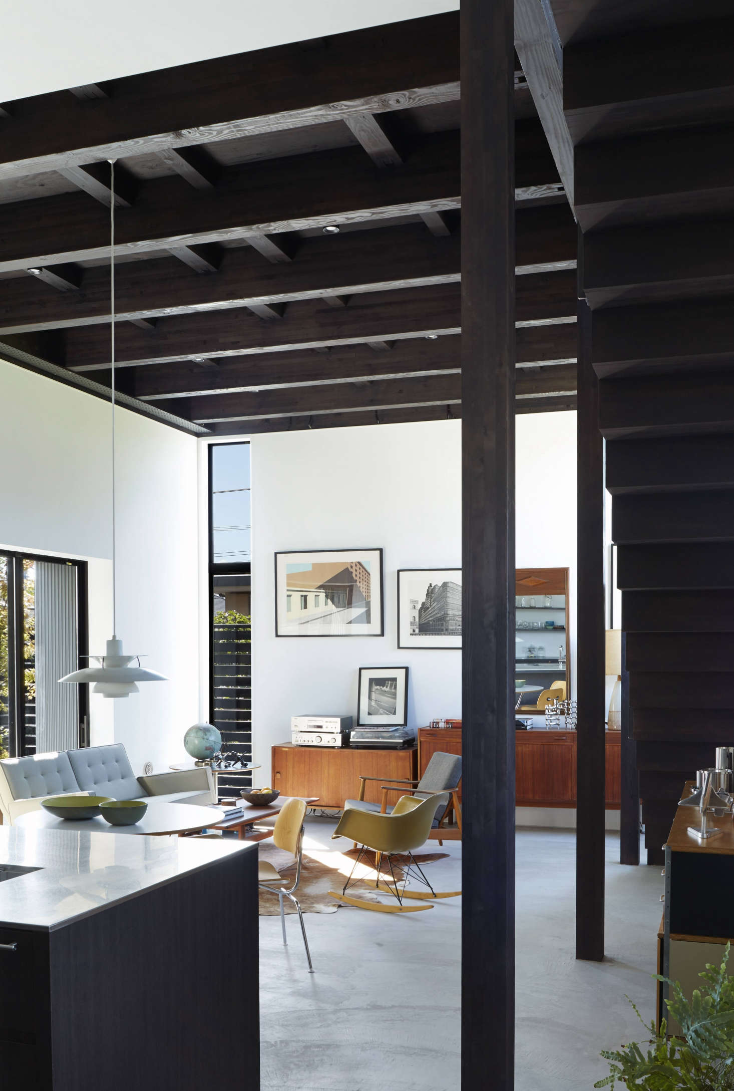 A Louis Poulsen pendant light, the PH5 by Poul Henningsen, hangs over the Noguchi table.