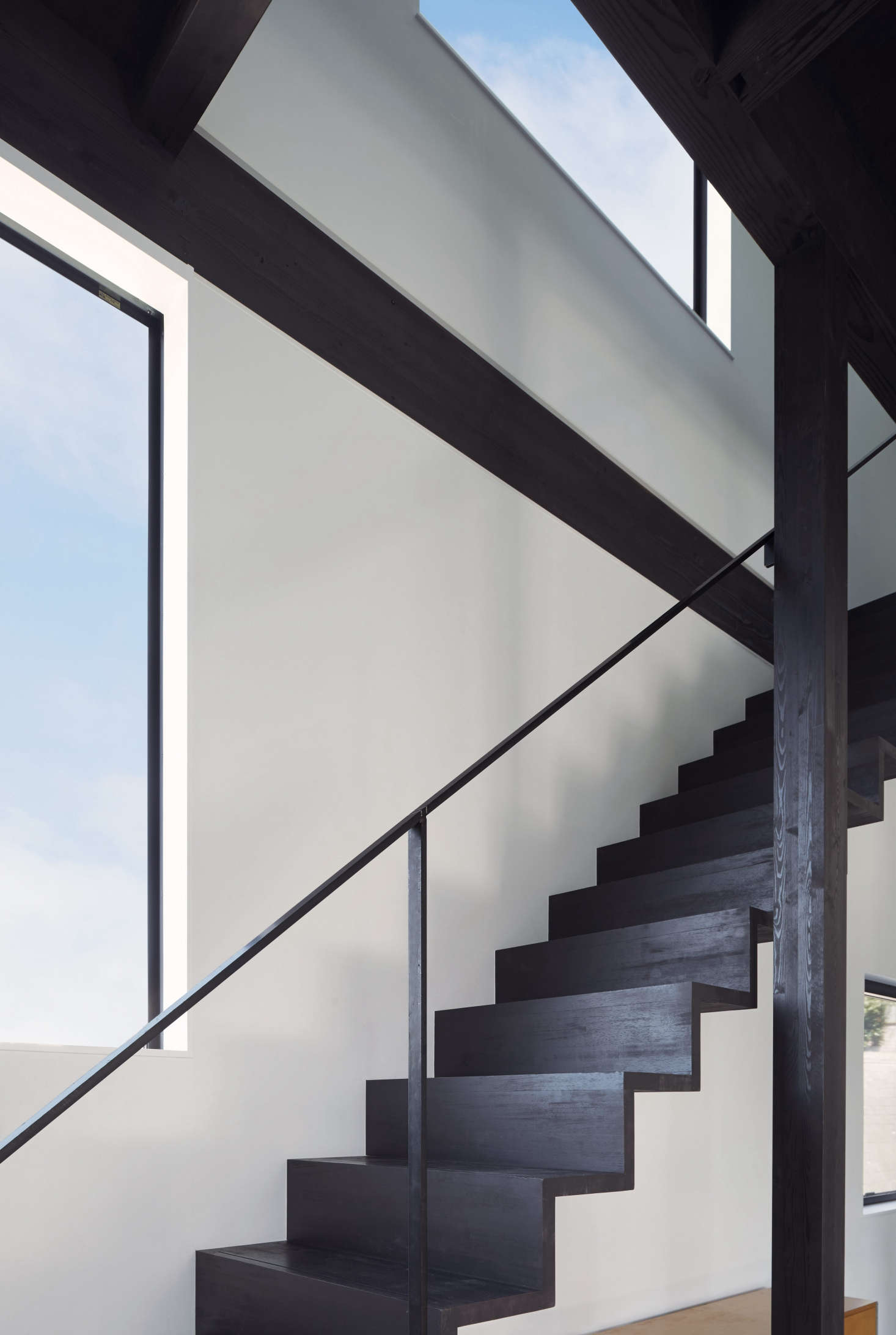 The Douglas fir stairs have a narrow steel railing (yes, it passed code). As for the safety question: 