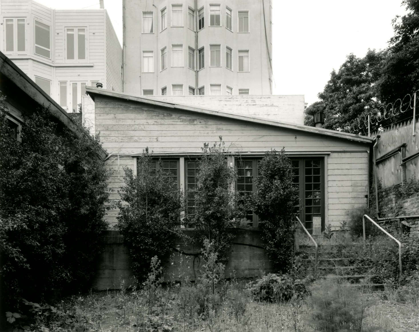 Housing as many as apartments at one time, the Filbert Cottages had fallen into a state of disrepair by 00. Photograph by Frank Deras.