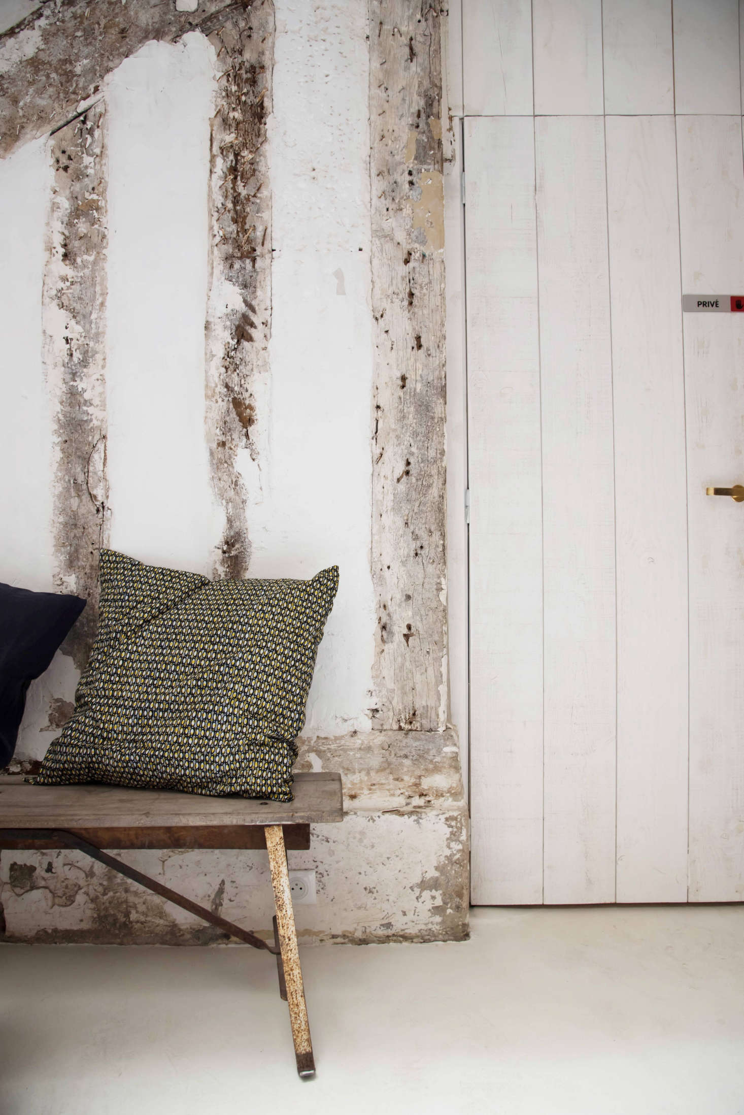 Renovate with respect to history. Beams are left to show through, and a bench, set under a sloped ceiling, makes a charming seating area.