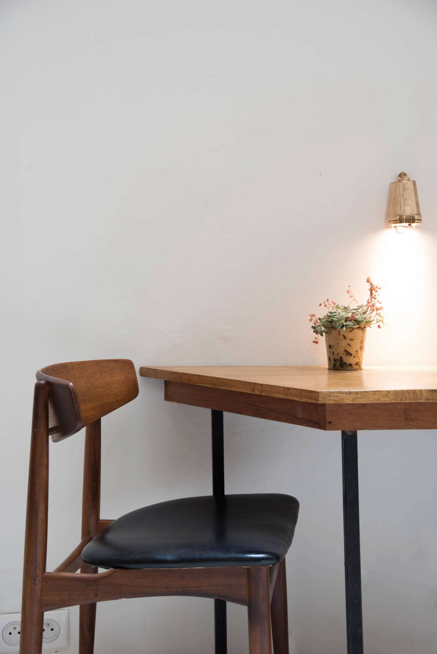 Another small statement: A single brass ship’s light from Paris-based shop Inédit Lighting.