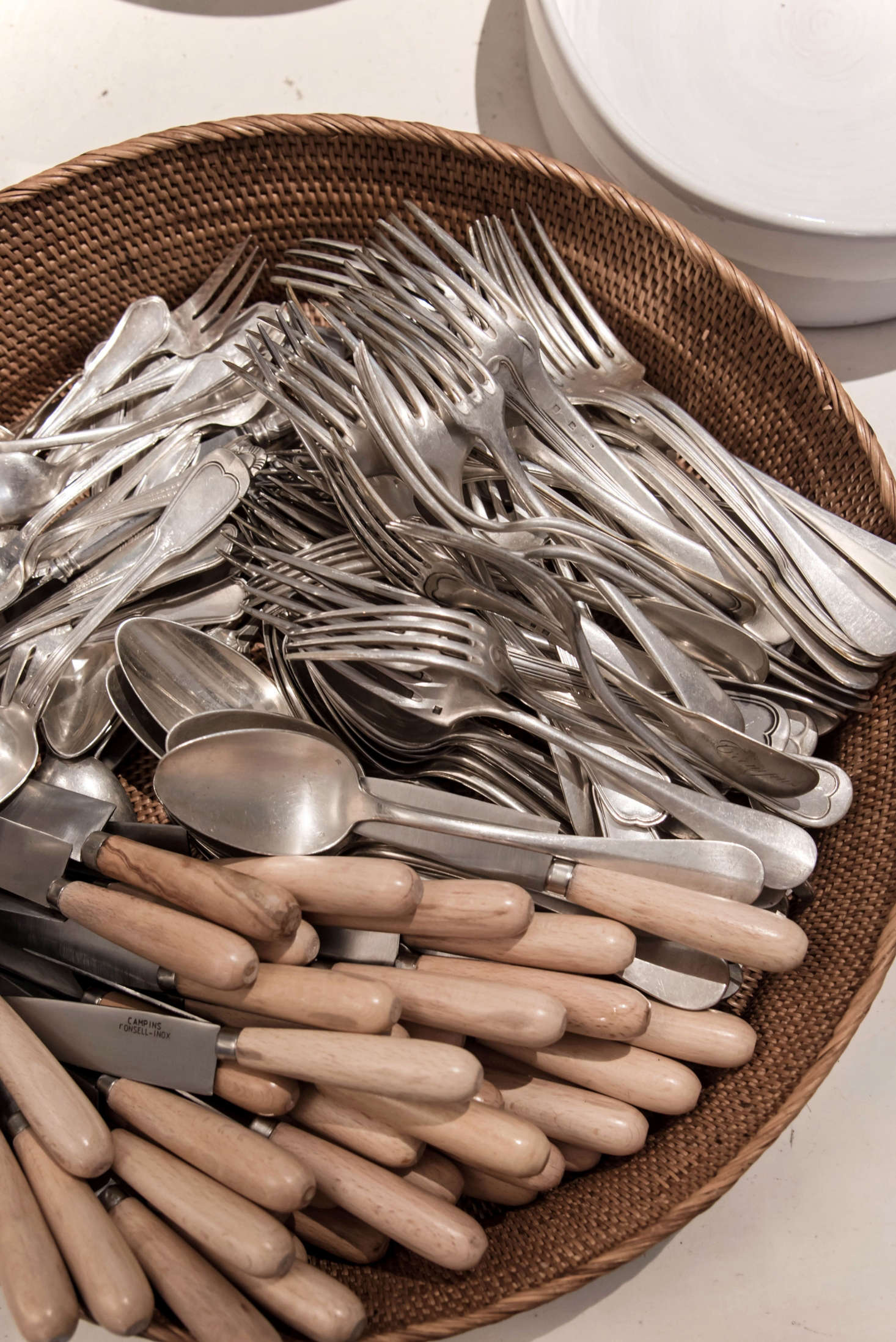 Seek out beautiful flatware for daily use. Here, knives handmade by an artisan in Mallorca mingle with mix-and-match silver.