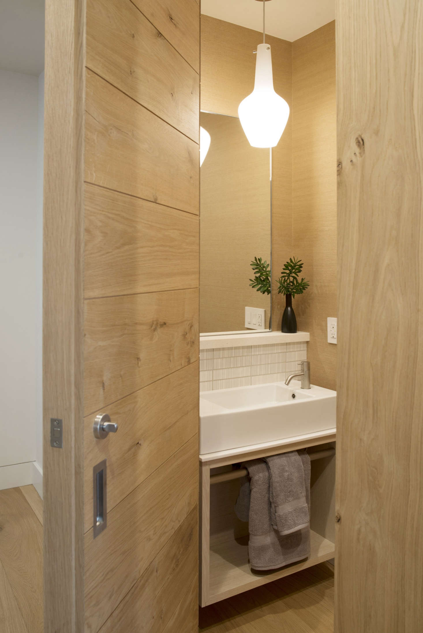 Each cottage has a powder room made of the same French oak. For the design, Buttrick was inspired by a project he visited in southern France (see Travels with an Architect: A Restored Chateau in France, Farm Included). 