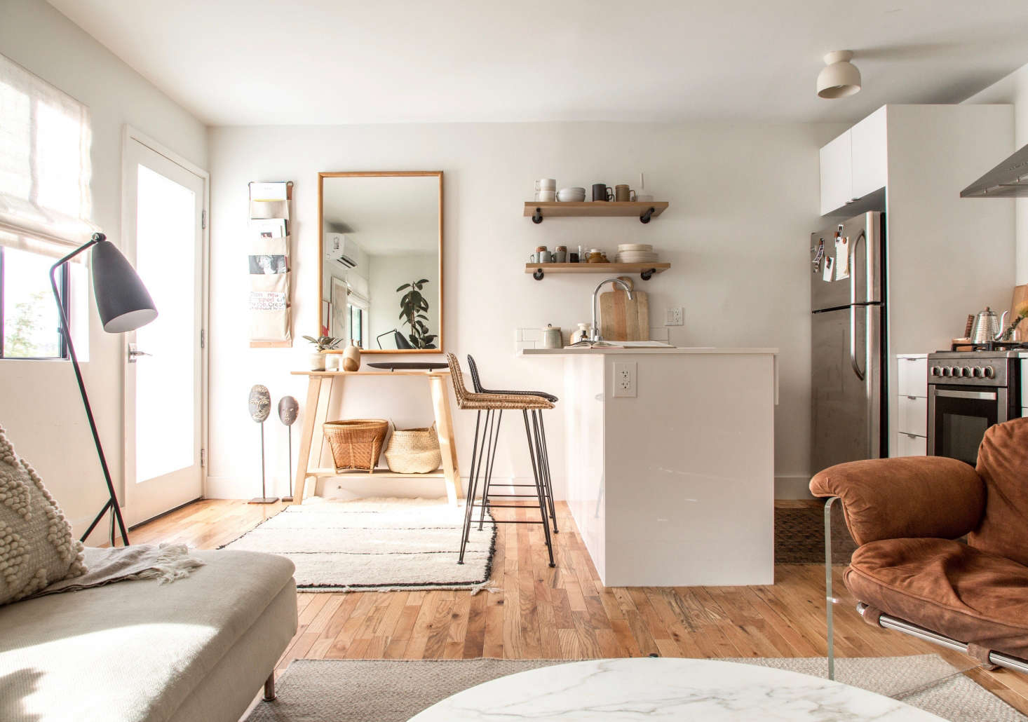 A single-door fridge fits into a built-in niche (with room to spare) in The LA Rental, Upgraded: Designer Paige Geffen’s 500-Square-Foot Challenge.