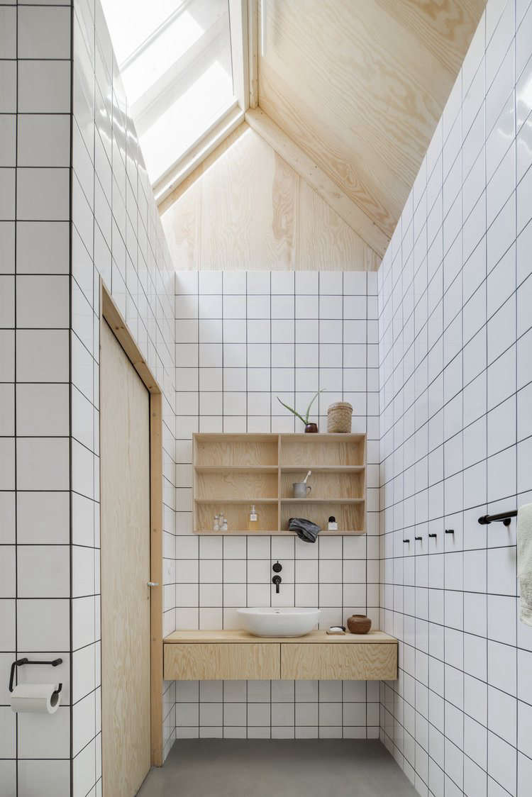 A simple plywood vanity (plus shelves and door) in A Cost-Conscious House in Sweden.