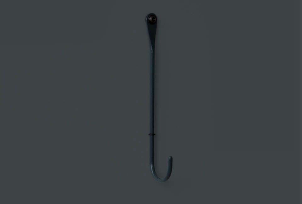 The Bite Hook in a dark greenish-blue lacquer.
