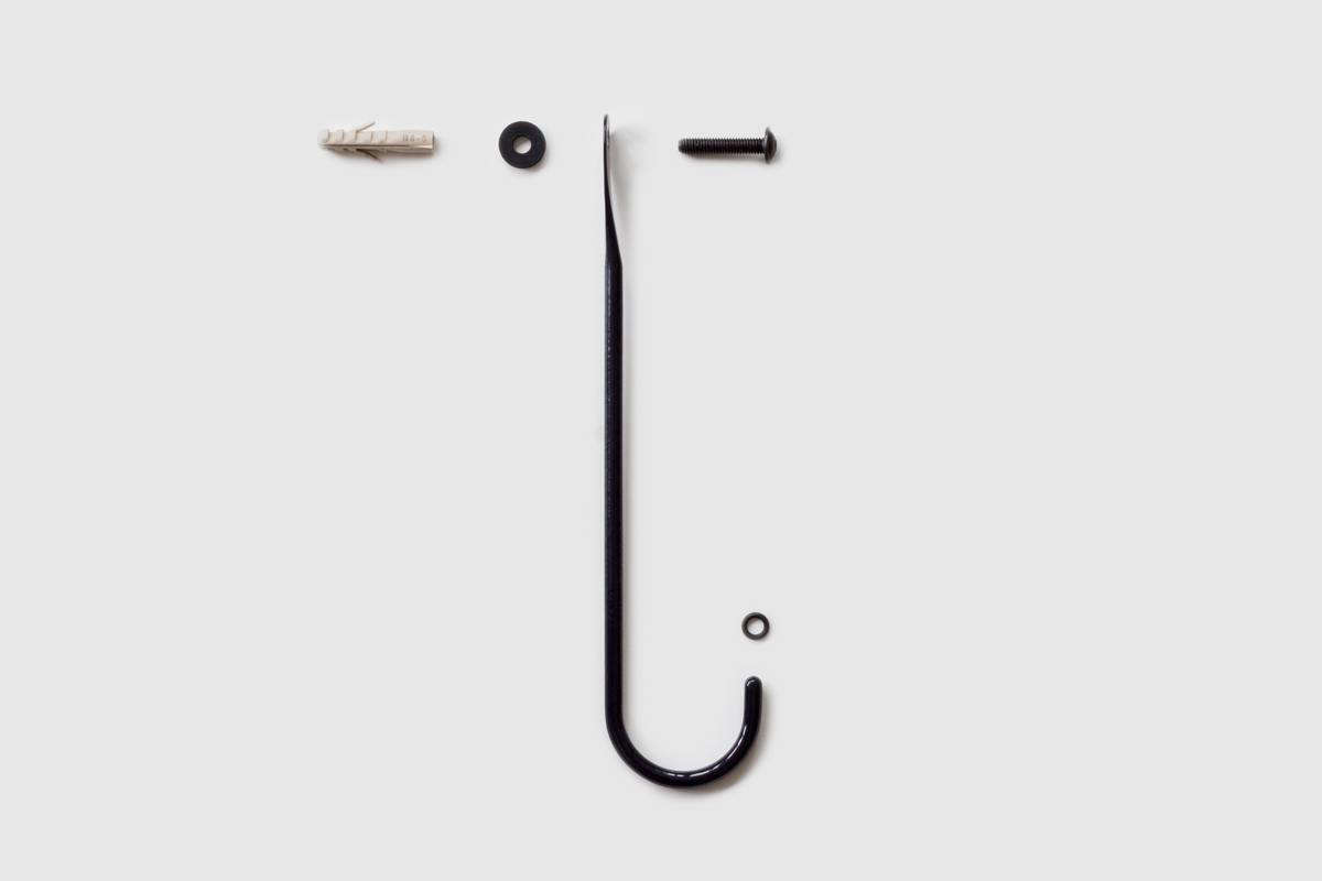 The hook mounts directly on the wall with a washer. Included is a small rubber ring to keep the hook from damaging the wall.