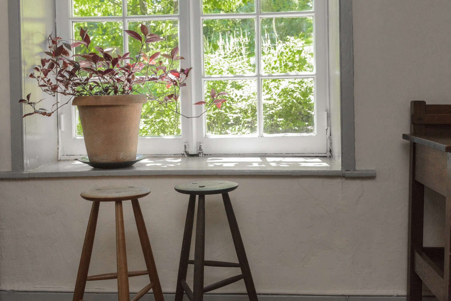 The daughter of the late artist and landscape designer Judy Tomkins tipped us off to one of the more magical properties we’ve seen in a while: Tomkins’s 1750s house in the artists’ hamlet of Snedens Landing, New York, now on the market. It’s a house with history: It’s rumored that George Washington used the original stone room as his office in 1780; later the house played host to Tomkins’s dinner parties with the likes of Jasper Johns and Julia Child. The first three-legged Sawkille stool was designed for Tomkins, based off her own design. Her daughter writes: “Stepping into Judy’s house is like stepping into another world. Another time. Another sensibility. A world where artists once gathered and nurtured each other. A world where the simplest gestures of life were elevated to the art of living. A world where ‘home’ was a reflection of a life well lived.” Stay tuned for a tour of the gardens next week on Gardenista.