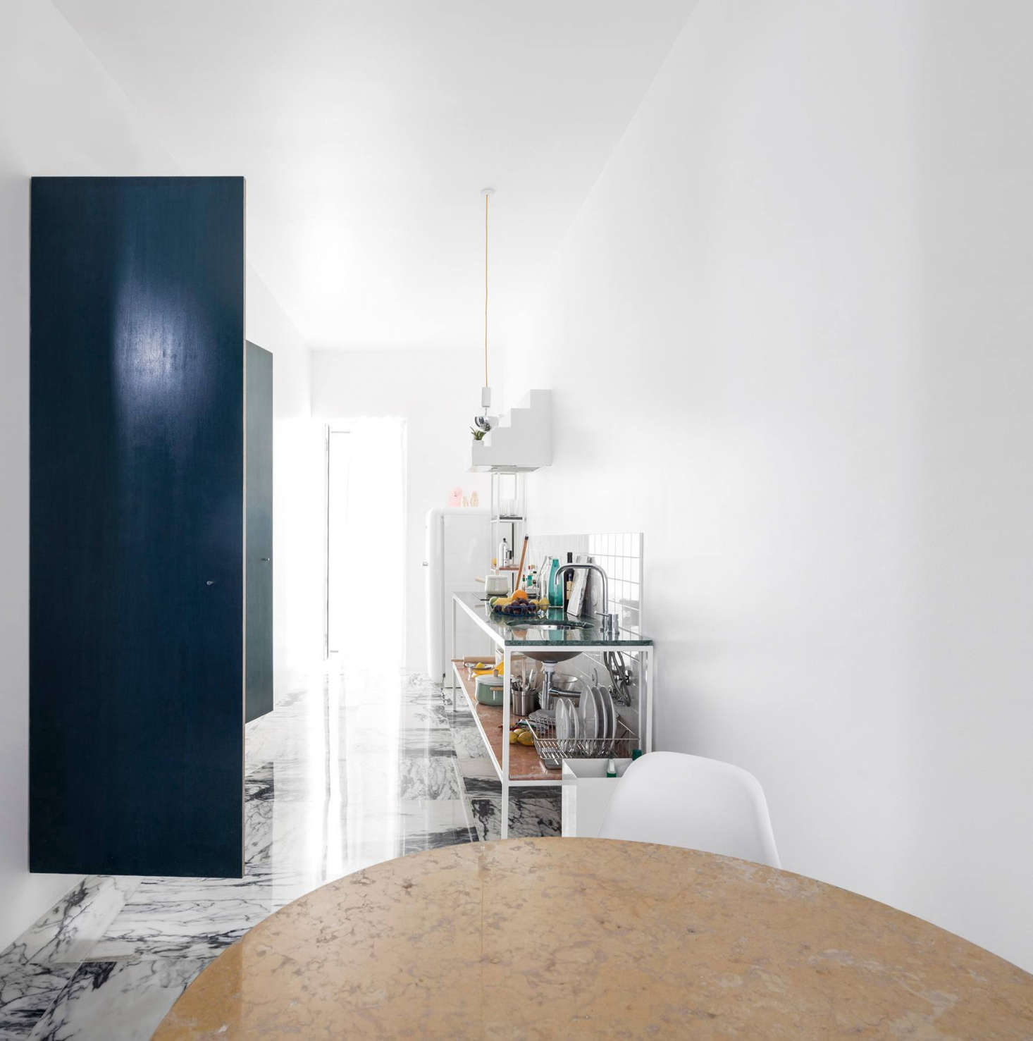 In Lisbon, a Narrow but Glamorous Marble-Clad Apartment